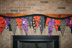 bandanna crafts hung over fireplace - halloween themed