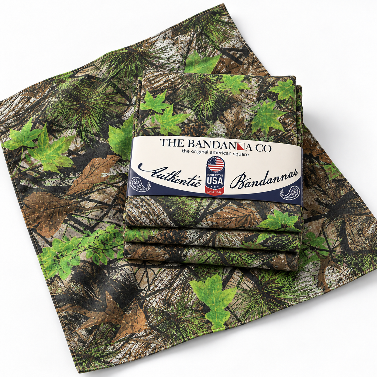 Buck County camo bandanna unfolded showing the maple leaf, pine, and pinecone pattern, with a 4-pack
