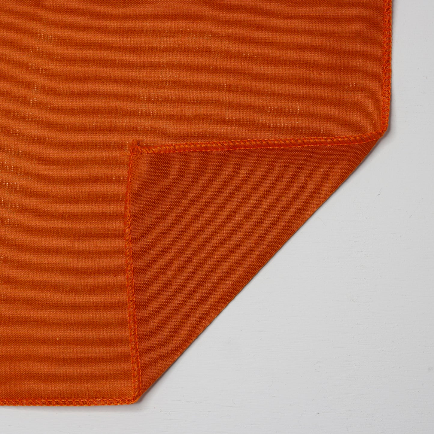 Burnt Orange Solid Color Bandanna 4 Pack - Cotton 22x22, showing detailed stitching and vibrant color