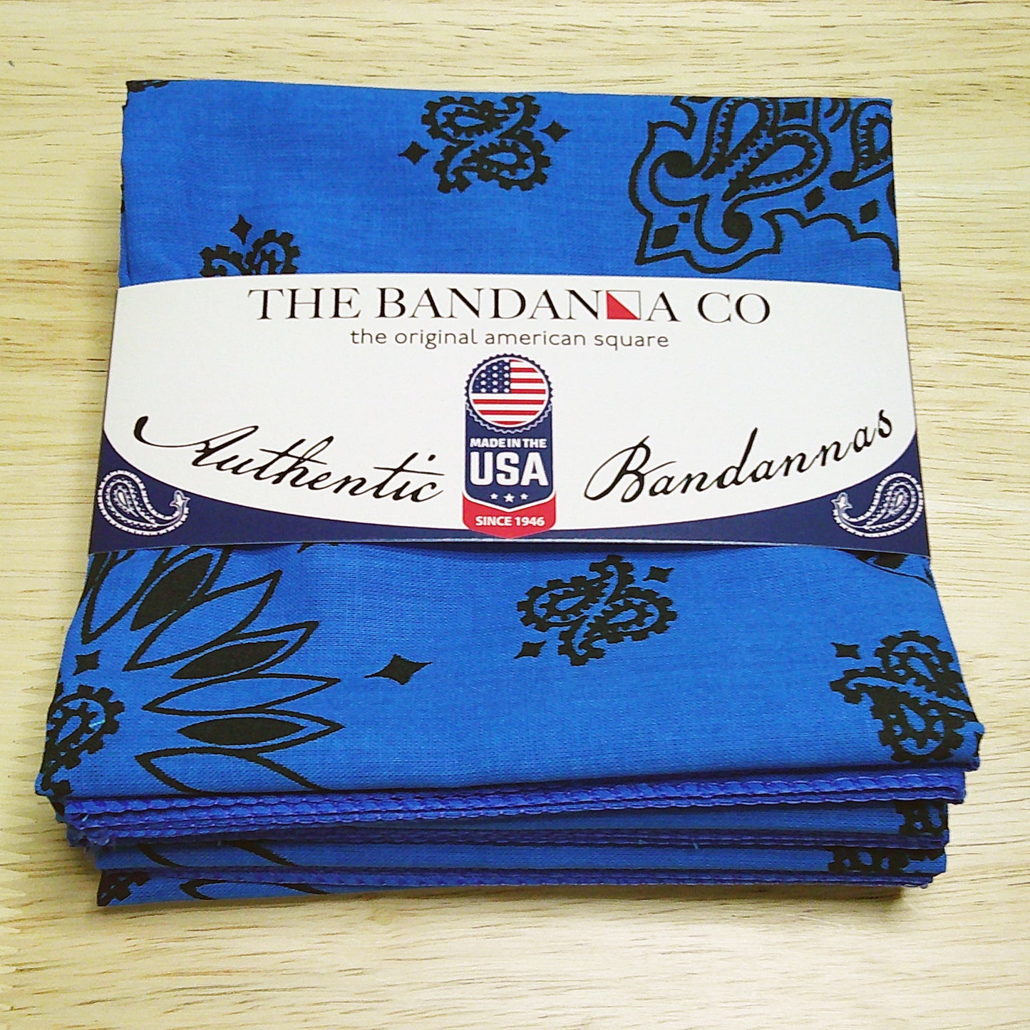 Contemporary Paisley Bandannas - 4-Pack, made in the USA, 100% cotton, 22" x 22", blue with black paisley design.