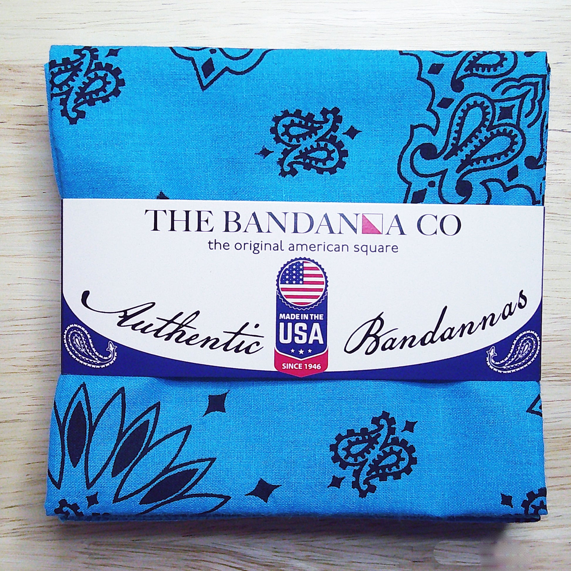 Contemporary Paisley Bandannas - 4-Pack, made in the USA, featuring blue rolled hem edges and true two-sided print on 100% cotton fabric.