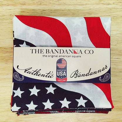 Stars and Stripes Bandanna - 4-Pack - Made In The USA, patriotic red, white, and blue design, 100% cotton, 22x22 inches, on wooden background.