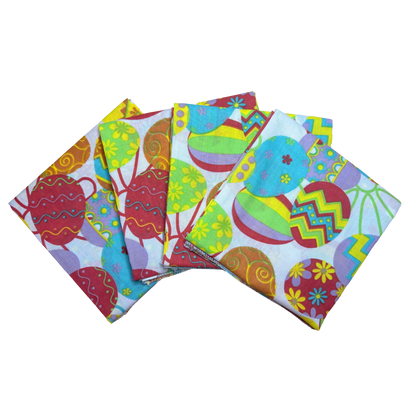 TOSSED EGGS - 22" Bandanna - 4-Pack featuring vibrant Easter egg designs, made with 100% cotton and paisley pattern, made in the USA.